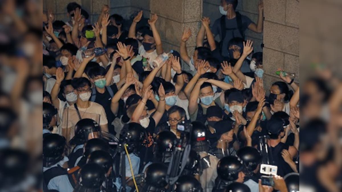 Hundreds protest in Hong Kong ahead of legislature debate on extradition law that will allow exchange of prisoners with China