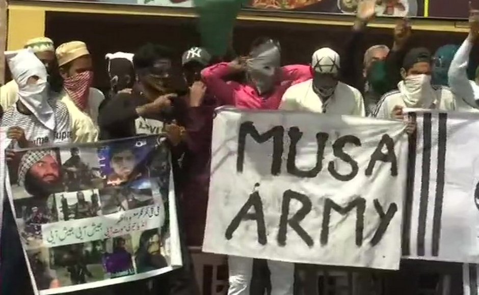 Locals pelted stones at security forces near Jamia Masjid in Srinagar and posters supporting terrorist Zakir Musa and UN designated terrorist Masood Azhar were also seen in the area. ANI Locals pelted stones at security forces near Jamia Masjid in Srinagar and posters supporting terrorist Zakir Musa and UN designated terrorist Masood Azhar were also seen in the area. ANI