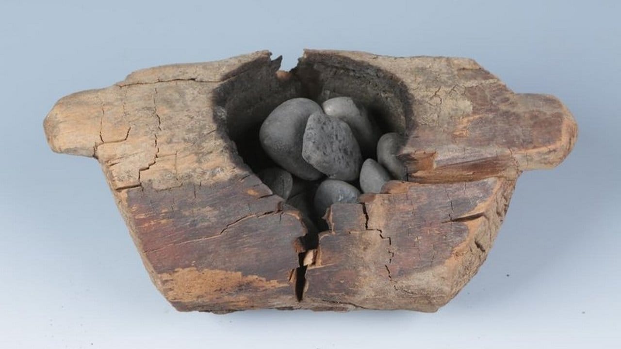 The typical brazier and burnt stones in ancient Pamirs. This example was found in tomb M12 at the Jirzankal cemetary and was analyzed in the current study. Image credit: Xinhua Wu