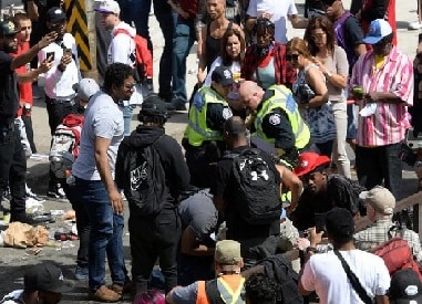 Four injured in gunfire at celebratory parade in Toronto; police arrest three suspects with links to two shootings at event