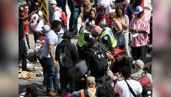 Four injured in gunfire at celebratory parade in Toronto; police arrest three suspects with links to two shootings at event
