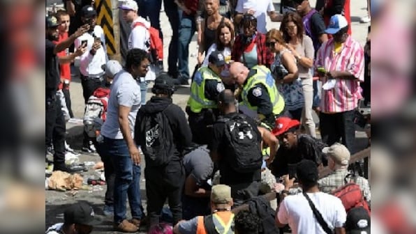Four injured in gunfire at celebratory parade in Toronto; police arrest three suspects with links to two shootings at event