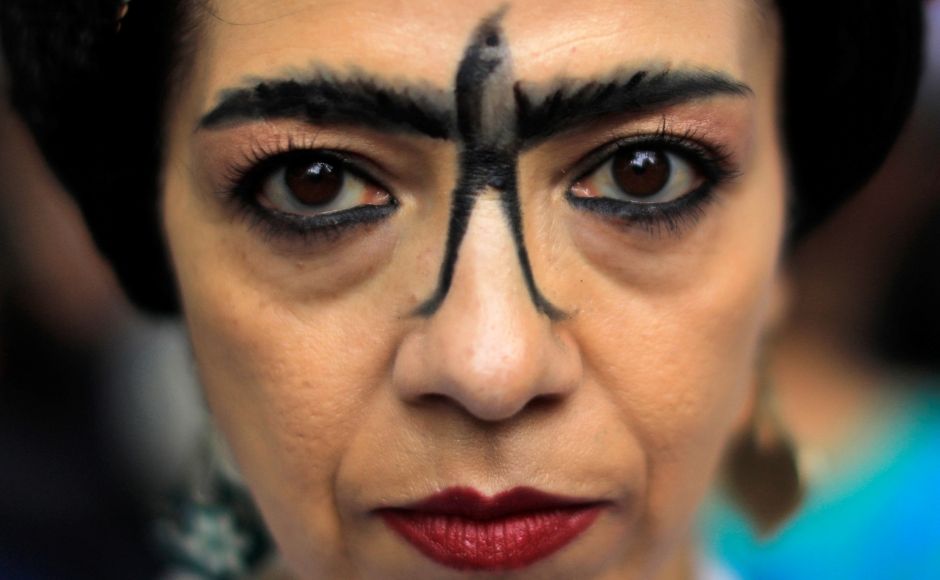 A fan dressed in a Frida Kahlo get-up during the parade in Mexico City. Retuters/ Luis Cortes A fan dressed in a Frida Kahlo get-up during the parade in Mexico City. Retuters/ Luis Cortes