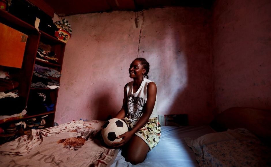 An orphan, Pouadjeu was raised by her aunt who forbade her from playing football. For her part, the soccer player chanelises her anger towards working on her game every day. Reuters/ Zohra Bensemra An orphan, Pouadjeu was raised by her aunt who forbade her from playing football. For her part, the soccer player chanelises her anger towards working on her game every day. Reuters/ Zohra Bensemra