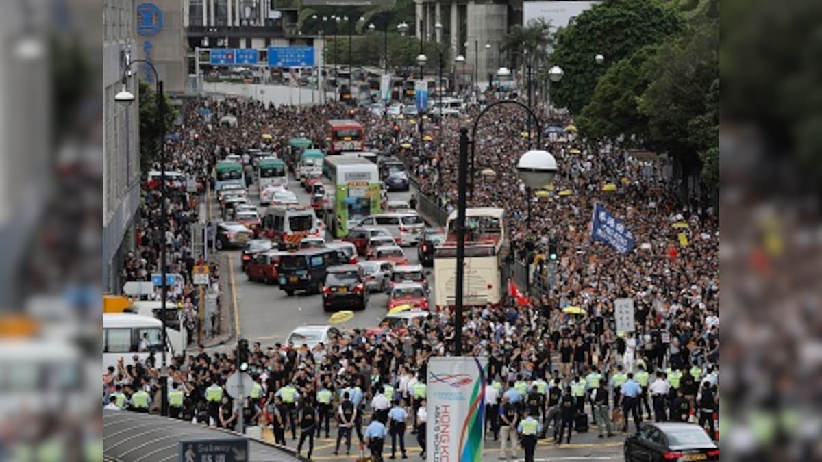 Thousands of protestors march towards Hong Kong’s controversial West Kowloon station to demand scrapping of extradition bill