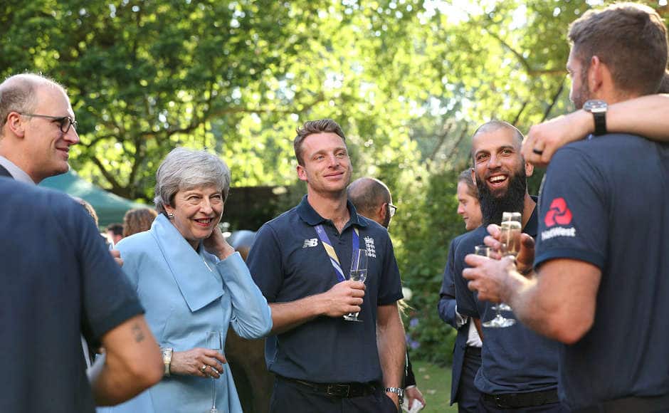 Theresa May, Jos Buttler and Moeen Ali are all smiles in this picture. Reuters
