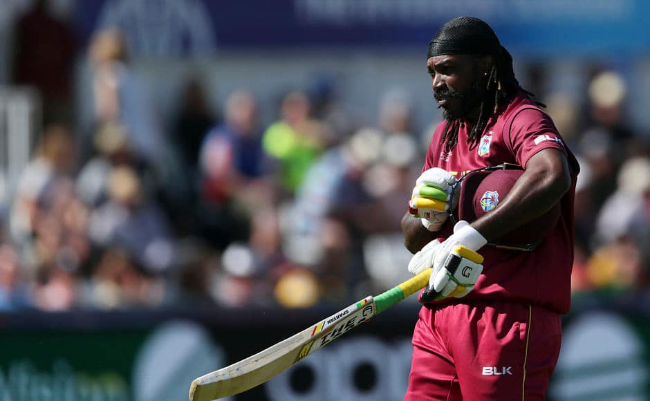 Chris Gayle walks back after being dismissed for 35. AP