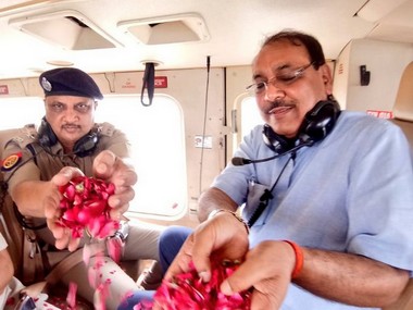 Ghaziabad DM, SSP take gov-provided chopper to shower flower petals on 'kanwarias' in district Ghaziabad DM, SSP take gov-provided chopper to shower flower petals on 'kanwarias' in district