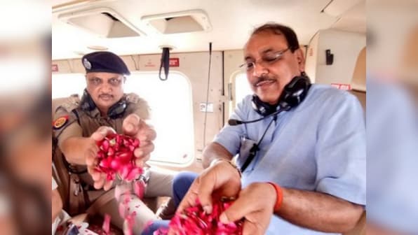 Ghaziabad DM, SSP take gov-provided chopper to shower flower petals on 'kanwarias' in district