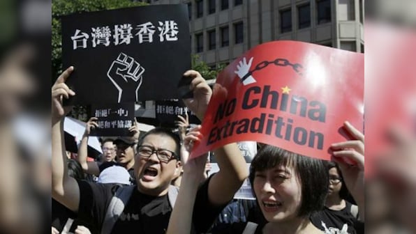 China hints at deployment of military in Hong Kong to quell anti-extradition protests that have raged for past 2 months