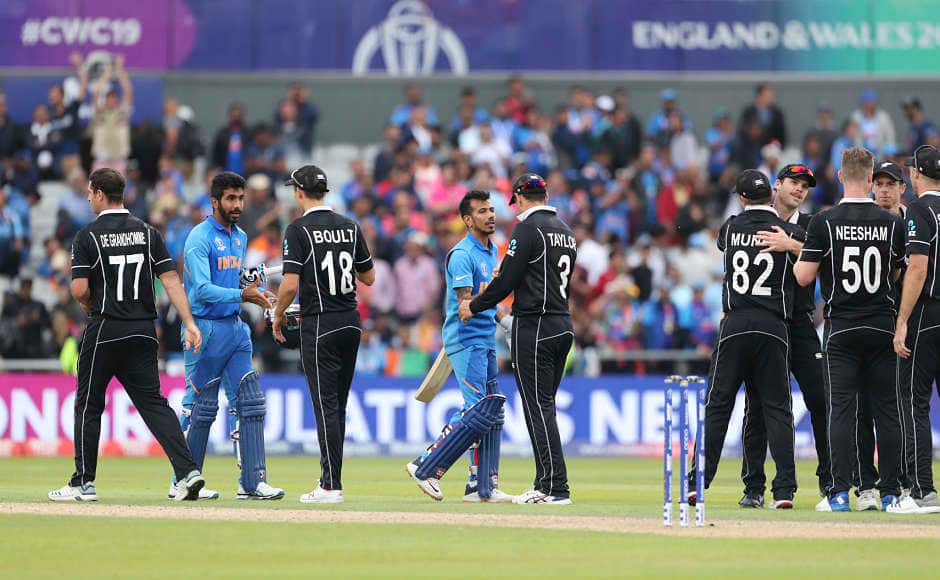 India and New Zealand players shake hands after the latter clinched a thrilling win to reach the Cricket World Cup final for the second consecutive time. AP 