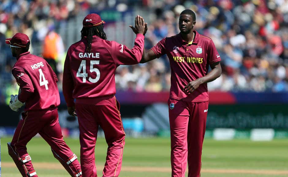 Jason Holder celebrates the dismissal of Sri Lanka captain Dimuth Karunaratne. AP