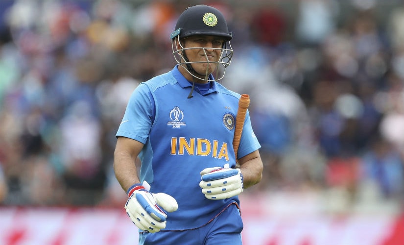 M Dhoni's picture of pain and defeat will haunt his fans. AP