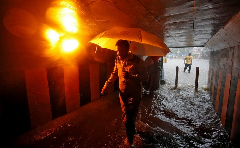 The suburban areas received around 20 mm rainfall in just three hours starting 8:30 am, an official at the India Meteorological Department's (IMD) centre here said. A commuter walks in a flooded underpass during heavy rains in Mumbai. AFP The suburban areas received around 20 mm rainfall in just three hours starting 8:30 am, an official at the India Meteorological Department's (IMD) centre here said. A commuter walks in a flooded underpass during heavy rains in Mumbai. AFP