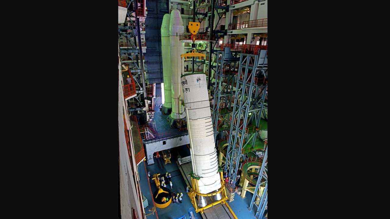 ISRO engineers hoist the L110 i.e. the core stage to integrate it with the two S200 solid rocket boosters. Image credit: ISRO ISRO engineers hoist the L110 i.e. the core stage to integrate it with the two S200 solid rocket boosters. Image credit: ISRO