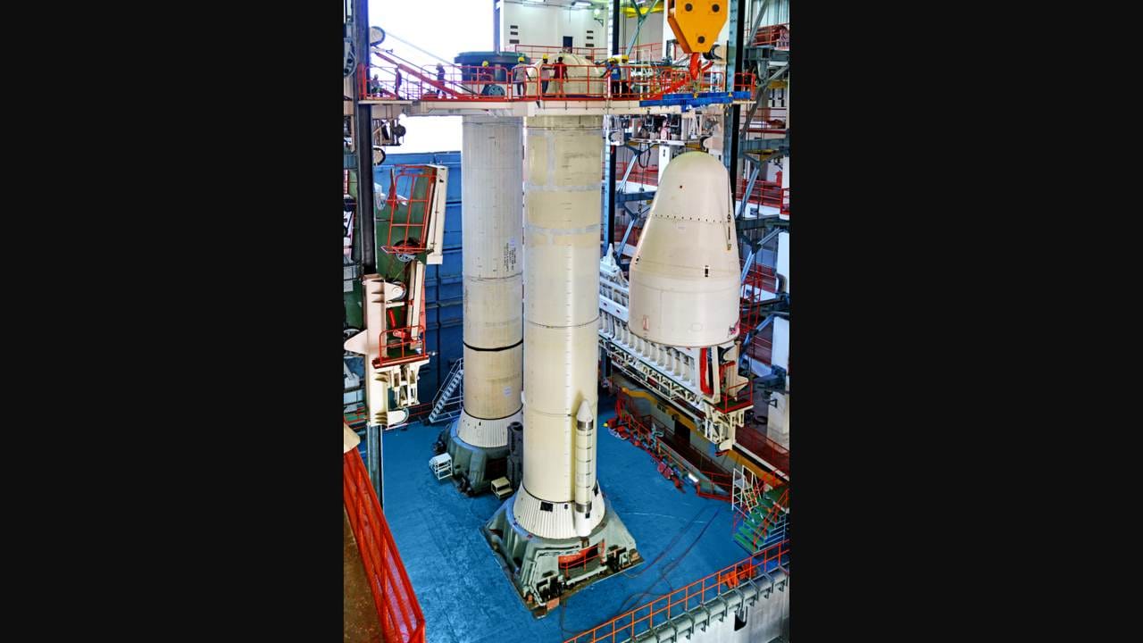 The slanted nose cones of S200 solid side boosters are being placed on the boosters. These were modified from the GSLV to reduce the vibrations inside the rocket for future man missions. Image credit: ISRO The slanted nose cones of S200 solid side boosters are being placed on the boosters. These were modified from the GSLV to reduce the vibrations inside the rocket for future man missions. Image credit: ISRO