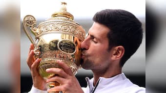 Wimbledon 2019: Novak Djokovic holds nerve in knife-edge encounter to beat Roger Federer and clinch fifth title