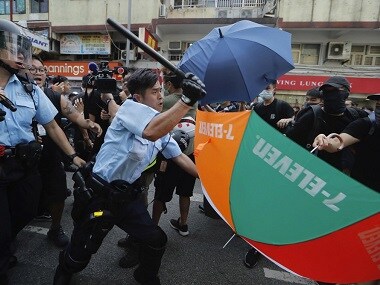 Hong Kong clashes: Violence continues as police use force on thousands of protesters marching against traders from mainland China