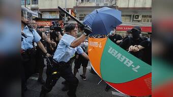 Hong Kong clashes: Violence continues as police use force on thousands of protesters marching against traders from mainland China
