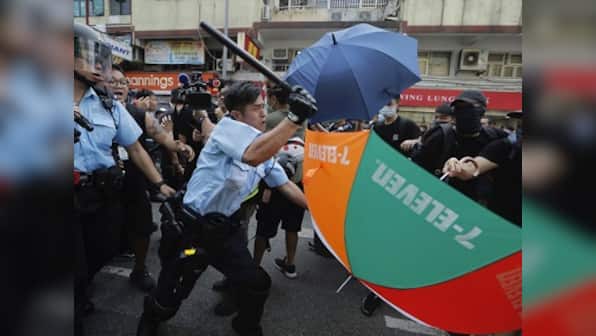 Hong Kong clashes: Violence continues as police use force on thousands of protesters marching against traders from mainland China
