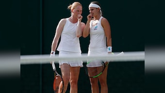 Sealed with a kiss! Alison Van Uytvanck beats partner, on and off the court, Greet Minnen in first match