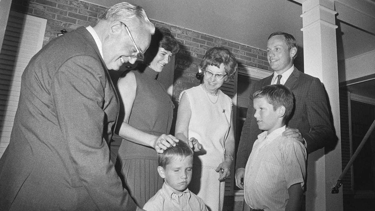 Apollo 11 astronaut Neil Armstrong (right) stands with his family after arriving at his parents' home in Wapakoneta, Ohio, US. Image: AP.