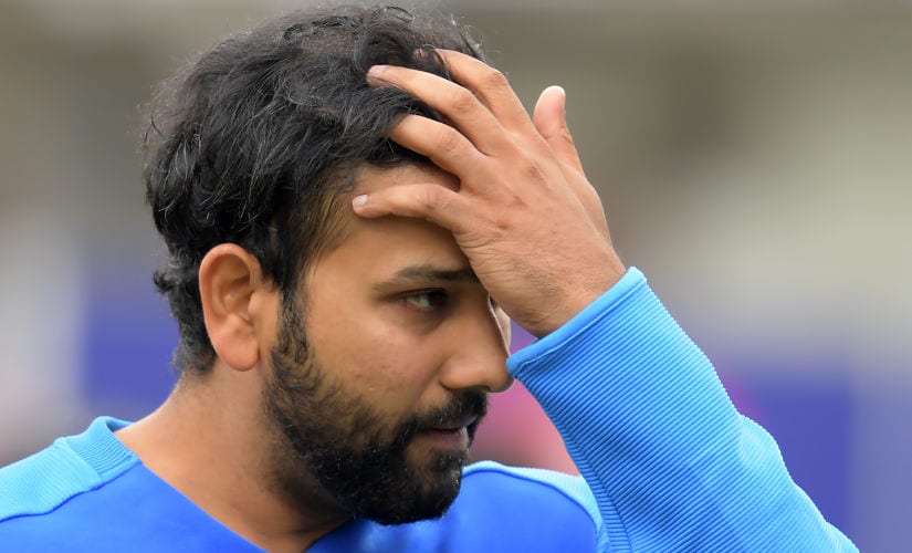 India’s Rohit Sharma reacts at the end of play during the 2019 Cricket World Cup first semi-final between New Zealand and India at Old Trafford in Manchester, northwest England, on July 10, 2019. - New Zealand beat India by 18 runs. (Photo by Dibyangshu Sarkar / AFP) / RESTRICTED TO EDITORIAL USE