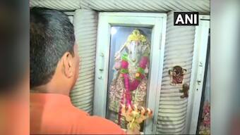 Locals offer prayers at Delhi's Durga temple vandalised during last week's clashes between two group