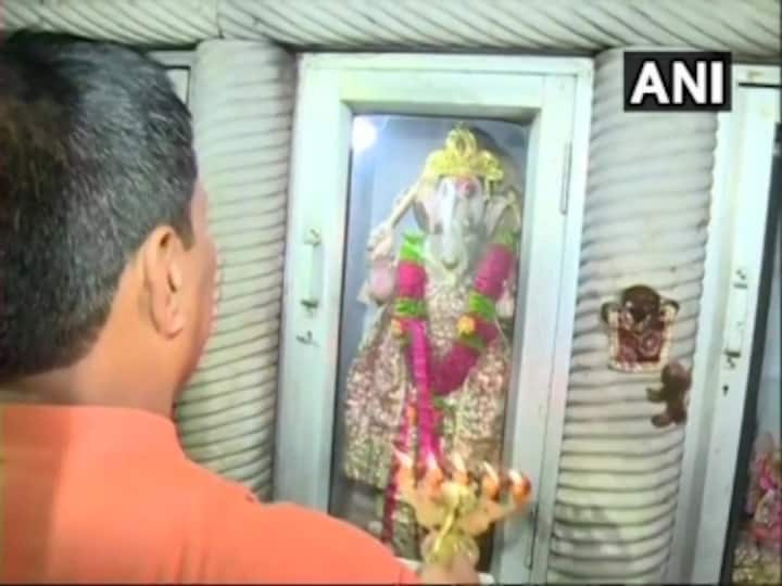 Locals offer prayers at Delhi's Durga temple vandalised during last week's clashes between two group