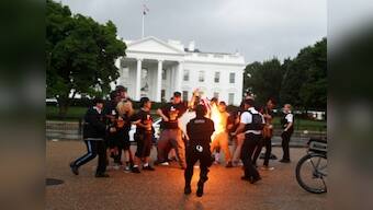 Clashes erupt outside White House after protesters torch US flag on American Independence Day; two secret service agents injured
