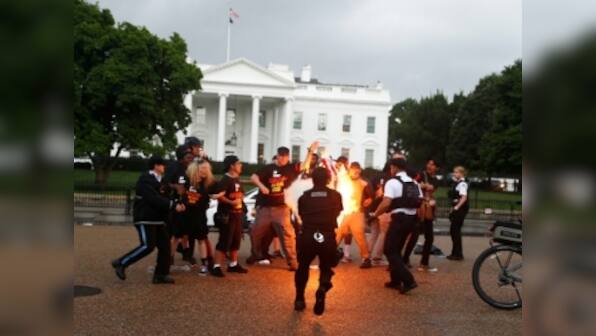 Clashes erupt outside White House after protesters torch US flag on American Independence Day; two secret service agents injured