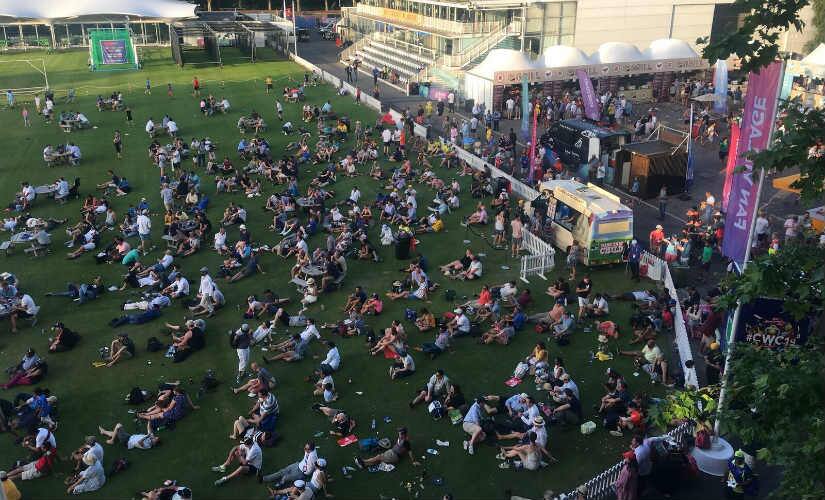 Fans watch the match on the big screen. 