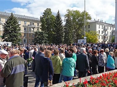 People gather for the funerals of the five Russian scientists. AP