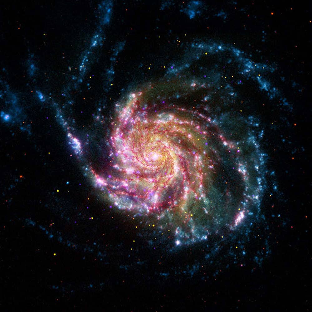 This an image of the pinwheel galaxy or messier 101 which has combined data from four different telescopes including the Spritzer telescope. This galaxy is 70 percent larger than our Milky Way and is 21 million light-years away from the Earth. Image credit: NASA/JPL This an image of the pinwheel galaxy or messier 101 which has combined data from four different telescopes including the Spritzer telescope. This galaxy is 70 percent larger than our Milky Way and is 21 million light-years away from the Earth. Image credit: NASA/JPL