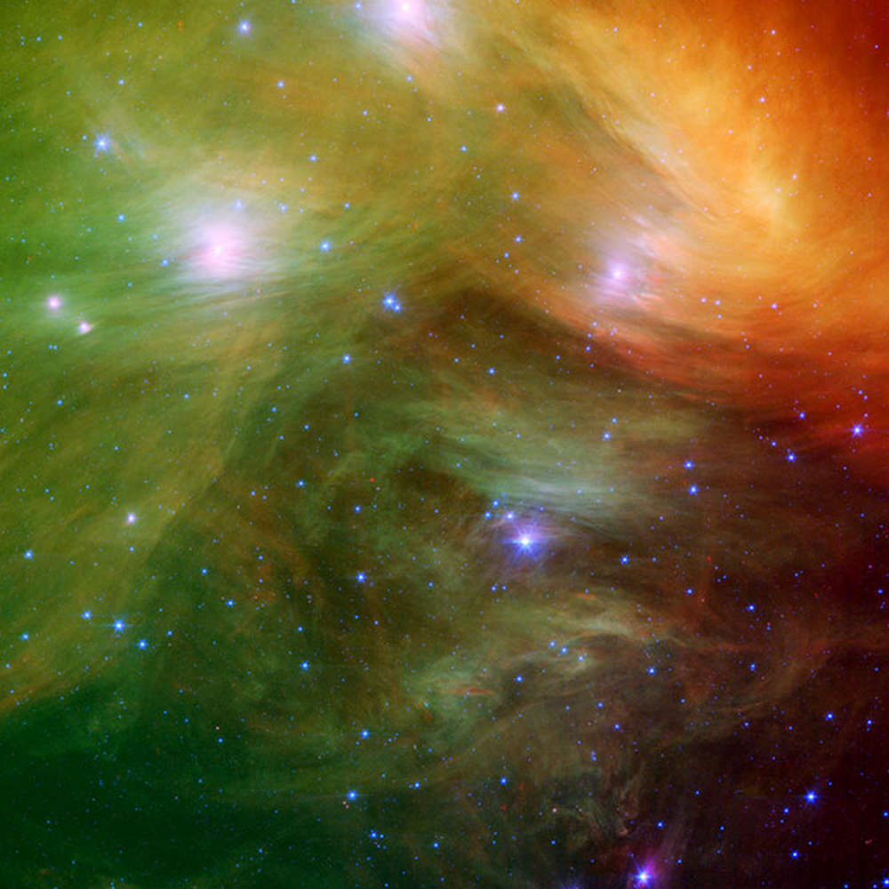The Spitzer telescope has zoomed into the star cluster known as the Pleiades or the Seven Sisters. The densest parts of the dust clouds surrounding the stars are seen in yellow and red while the outskirts of the clouds appear in green. Image credit: NASA/JPL The Spitzer telescope has zoomed into the star cluster known as the Pleiades or the Seven Sisters. The densest parts of the dust clouds surrounding the stars are seen in yellow and red while the outskirts of the clouds appear in green. Image credit: NASA/JPL