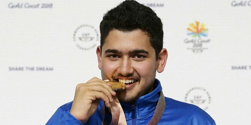 Anish Bhanwala of India celebrates with his gold medal at the men's 25m Rapid Fire Pistol final. The 15-year-old is India's youngest-ever CWG gold medallist. PTI