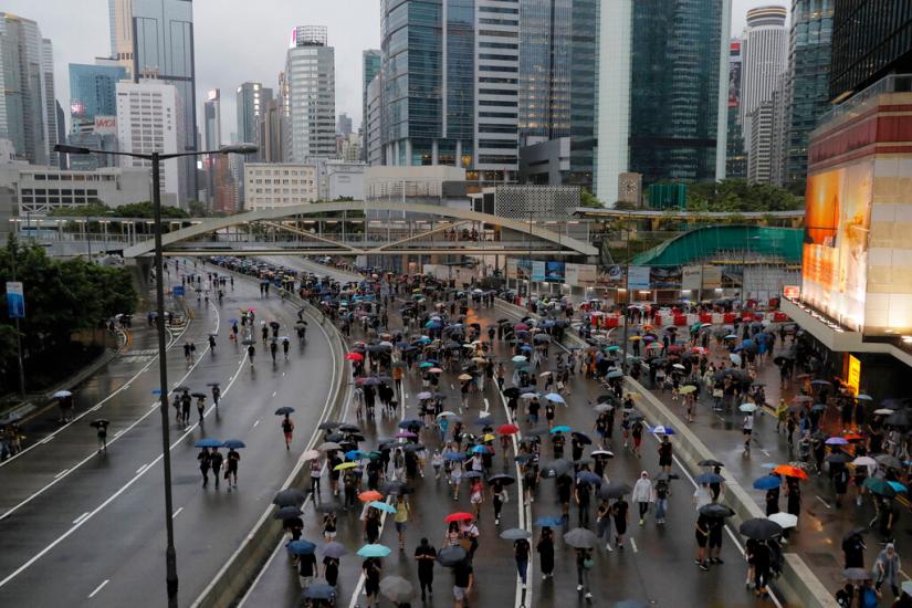 Hong Kong sees largest rally in weeks as protesters flood streets braving torrential rains despite warnings from Beijing Hong Kong sees largest rally in weeks as protesters flood streets braving torrential rains despite warnings from Beijing