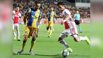 Champions League: 10-man Ajax held to goalless draw at APOEL in playoff round first-leg match; Slavia Prague beat CFR Cluj