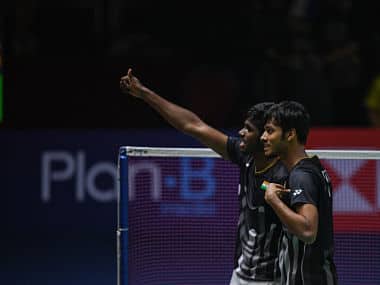 India’s Chirag Shetty (R) and Satwiksairaj Rankireddy celebrate beating China’s Li Jun Hui and Liu Yu Chen during their men’s doubles final match at the Thailand Open badminton tournament in Bangkok on August 4, 2019. (Photo by Chalinee Thirasupa / AFP)