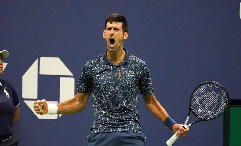 Serbia’s Novak Djokovic reacts to a point while playing Argentina’s Juan Martin del Potro during their Men’s Singles Finals match at the 2018 US Open at the USTA Billie Jean King National Tennis Center in New York on September 9,2018. (Photo by TIMOTHY A. CLARY / AFP)