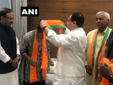 Wrestler Babita Phogat and her father Mahavir Singh Phogat meet BJP Working President JP Nadda, after joining the party. Twitter/ANI