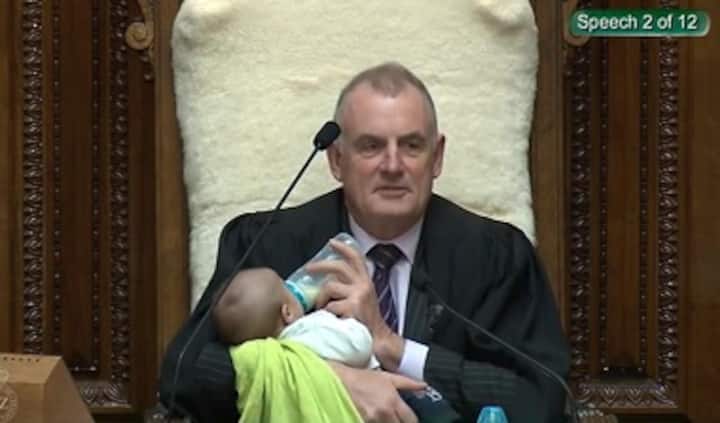 Image of New Zealand Speaker bottle feeding MP's baby during Parliament session goes viral on social media