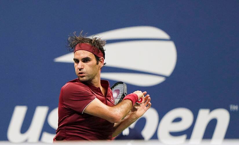 Switzerland’s Roger Federer returns the ball to Australia’s John Millman during their 2018 US Open Men’s Singles tennis match at the USTA Billie Jean King National Tennis Center in New York on September 3, 2018. (Photo by EDUARDO MUNOZ ALVAREZ / AFP)