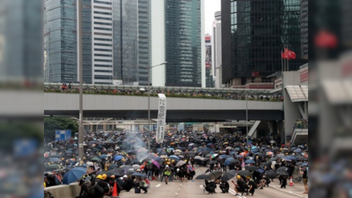 Hong Kong protests: Police use water cannons, tear gas on demonstrators defying rally ban outside parliament