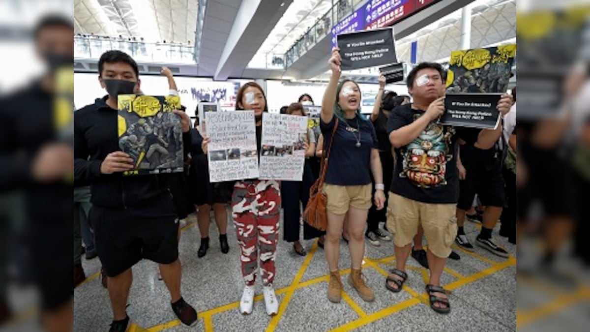 Hong Kong protests: Pro-democracy activists block some routes to city's airport after another night of violent protests