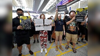 Hong Kong protests: Pro-democracy activists block some routes to city's airport after another night of violent protests