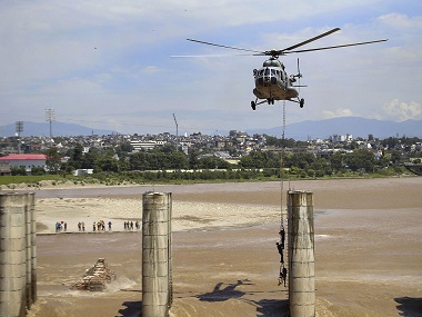 In daring operation, IAF airlifts four fishermen from under-construction bridge near overflowing Tawi river in Jammu In daring operation, IAF airlifts four fishermen from under-construction bridge near overflowing Tawi river in Jammu