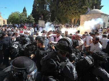 14 wounded in clashes between Muslim worshippers and Israeli Police at disputed holy site in Jerusalem