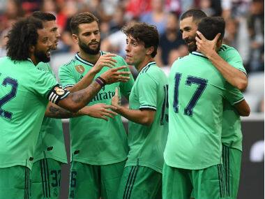 Karim Benzema (right) celebrates his goal. Image: AFP