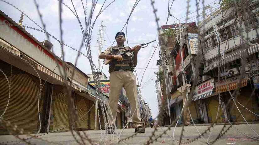 Jammu: CRPF personnel stand guard during restrictions, at Raghunath Bazar in Jammu, Monday, Aug 05, 2019. Restrictions and night curfews were imposed in several districts of Jammu and Kashmir as the Valley remained on edge with authorities stepping up security deployment. (PTI Photo)(PTI8_5_2019_000091B)